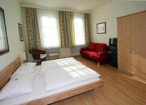 Posteľ alebo postele v izbe v ubytovaní Hotel Pension Alte Mühle