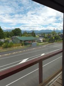 a view from a bus window of a highway at Ahaura Hotel in Greymouth