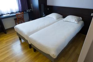 Postel nebo postele na pokoji v ubytování Cottage Logis Hôtel - Restaurant