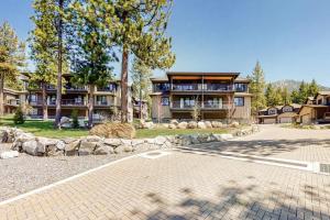 a large house with a driveway in front of it at Gondola Vista Luxury Villas by Ski Heavenly & Beaches in South Lake Tahoe