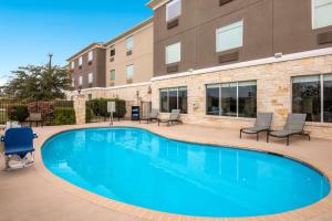 a swimming pool in front of a building at Best Western Plus Killeen/Fort Hood Hotel & Suites in Killeen