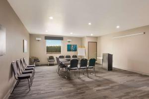 a conference room with a table and chairs and a podium at Best Western Plus Killeen - Fort Cavazos Hotel & Suites in Killeen +23 photos