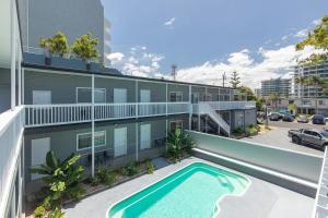 an aerial view of a building with a swimming pool at Jasmine Apartment in Forster