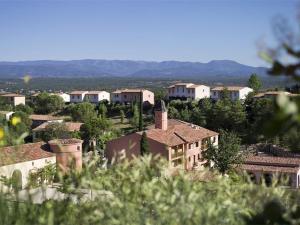 a view of a village with houses and trees at Maison Duplex 8 Pers avec Terrasse, 3 Ch, Parking Gratuit, Animaux Admis, Accès Piscine - FR-1-382-128 in Grospierres