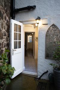 an open door leading to a hallway with at The Burrow in Kelso