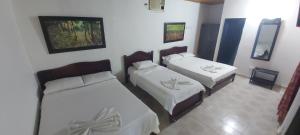 Postel nebo postele na pokoji v ubytování Hotel Sol y Mar