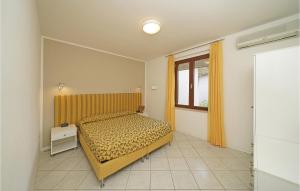 A bed or beds in a room at Bilocale