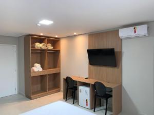 TV a/nebo společenská místnost v ubytování Hotel Solar Paulista