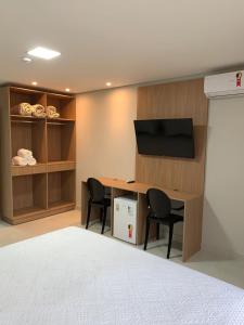 TV a/nebo společenská místnost v ubytování Hotel Solar Paulista