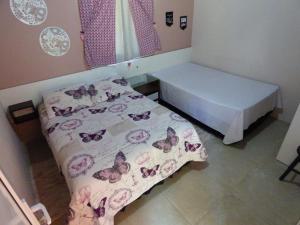 Meu Cantinho Canela客房内的一张或多张床位