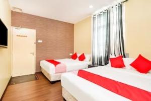 Postel nebo postele na pokoji v ubytování D'Pinetrees Hotel