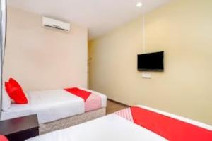 Postel nebo postele na pokoji v ubytování D'Pinetrees Hotel + 9 fotografií
