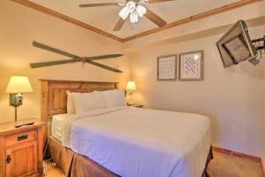a bedroom with a bed and a ceiling fan at Beaver Run Studio- Dog Friendly in Breckenridge