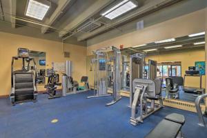 a gym with several treadmills and machines at Beaver Run Studio- Dog Friendly in Breckenridge