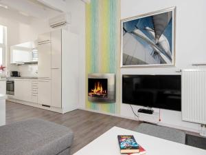 a living room with a fireplace in the wall at 6 person holiday home in Wendtorf in Wendtorf