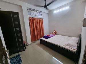 Кровать или кровати в номере The Economy Guesthouse