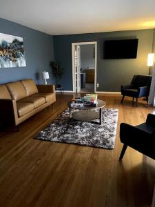 a living room with a couch and a coffee table at You won't want to leave! in Huntsville