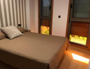 A bed or beds in a room at Apartamento La Buena Vida
