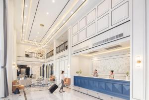 a rendering of an airport lobby with two people walking at Eastin Hotel Vientiane in Vientiane +184 photos