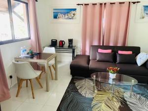 a living room with a couch and a table at Great location, right downtown Puerto plata . in San Felipe de Puerto Plata