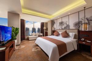 TV a/nebo společenská místnost v ubytování Guangdong Hotel (Zhuhai)