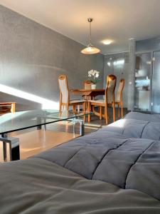 a bedroom with a bed and a table and chairs at Vivi in Wolfenbüttel