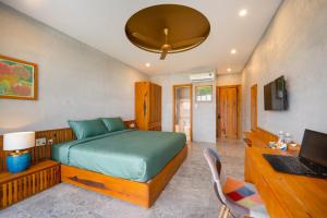 TV a/nebo společenská místnost v ubytování Bon Sand Villa & Spa Hoi An