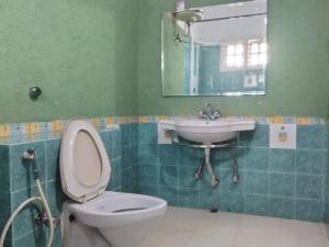 Koupelna v ubytování Prashanth Family Homestay
