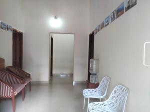 Posezení v ubytování Prashanth Family Homestay