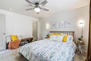 a bedroom with a bed and a ceiling fan at Urban Boho Caldwell 3 Bedroom Great for Families! in Caldwell