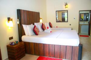 Katil atau katil-katil dalam bilik di Machcha Lodge Sigiriya