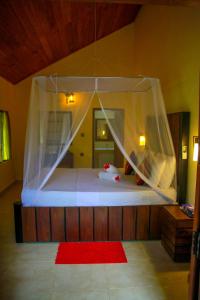 Katil atau katil-katil dalam bilik di Machcha Lodge Sigiriya