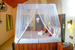 Katil atau katil-katil dalam bilik di Machcha Lodge Sigiriya