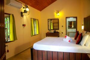 Katil atau katil-katil dalam bilik di Machcha Lodge Sigiriya