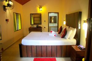 Katil atau katil-katil dalam bilik di Machcha Lodge Sigiriya