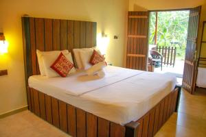 Katil atau katil-katil dalam bilik di Machcha Lodge Sigiriya