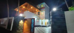a house at night with a bunch of stairs in front at Madhav Mansion Beach Resort in Varkala
