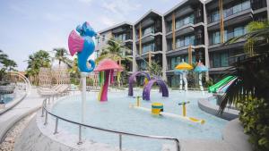 a water park in front of a building at Carapace Residents Huahin-Khaotao in Khao Tao