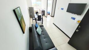 Μια τηλεόραση ή/και κέντρο ψυχαγωγίας στο APARTAMENTO en el QUINDÍO cerca al PARQUE DEL CAFÉ