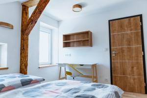 Postel nebo postele na pokoji v ubytování Apartmány Jabloneček