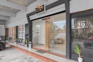 a store front with a sign on the door at Urbanview Hotel Cozy Samarinda by RedDoorz in Samarinda