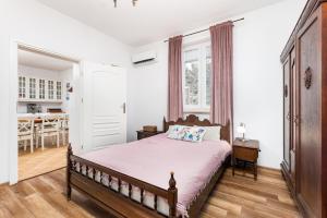 a bedroom with a bed and a dining room at Dom Nad Narwią Łubienica 15 in Łubienica