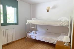 Postel nebo postele na pokoji v ubytování Apartamentos Canillo 3000