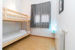 Postel nebo postele na pokoji v ubytování Apartamentos Canillo 3000