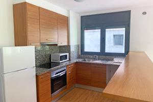 Kuchyň nebo kuchyňský kout v ubytování Apartamentos Canillo 3000