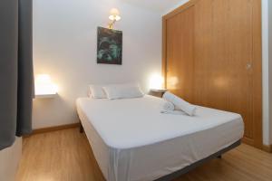 Postel nebo postele na pokoji v ubytování Apartamentos Canillo 3000