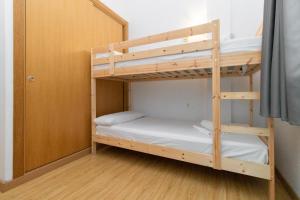 Postel nebo postele na pokoji v ubytování Apartamentos Canillo 3000