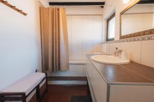 a bathroom with a sink and a mirror at Kuca za odmor M11 in Kupres +11 photos