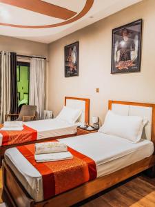 Ένα ή περισσότερα κρεβάτια σε δωμάτιο στο Valiha Hotel Antananarivo +108 φωτογραφίες