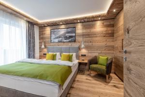 Łóżko lub łóżka w pokoju w obiekcie Apartment NH96 inklusive kostenfreiem Eintritt in die Alpentherme